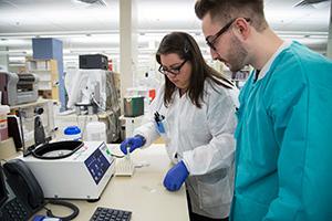 Student being instructed by a staff technologist during his clinical rotation.